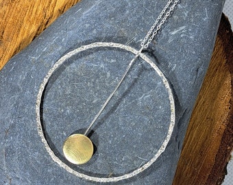 Sterling silver textured hoop pendant necklace with brass circle pendulum: Handmade, unique, geometric jewellery
