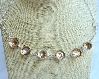 Twisted wire necklace with sterling silver, copper and brass dome cups