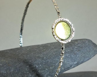 Sterling silver textured round circle bangle with brass centrepiece: Handmade, unique, geometric jewellery