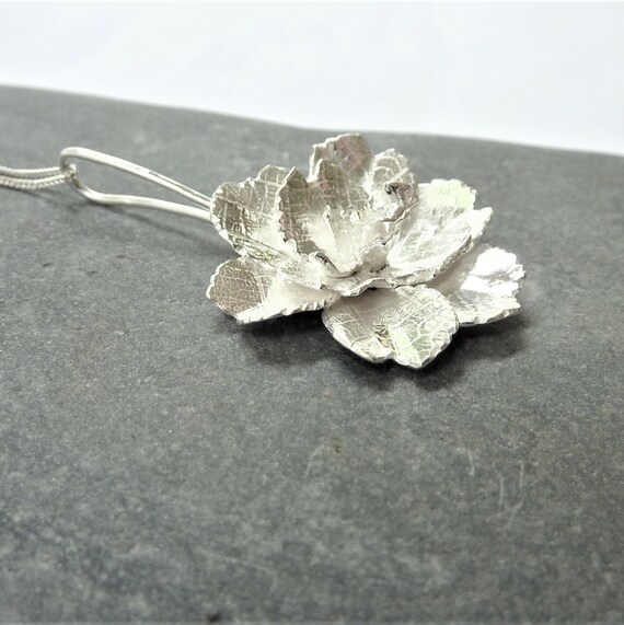 Camellia flower pendant with leaf texture: Handmade, sterling silver