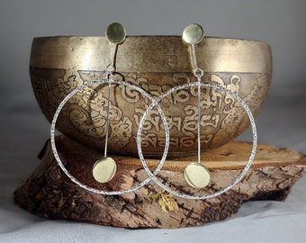 Sterling silver textured hoop earrings with brass circle pendulum: Handmade, unique, geometric jewellery