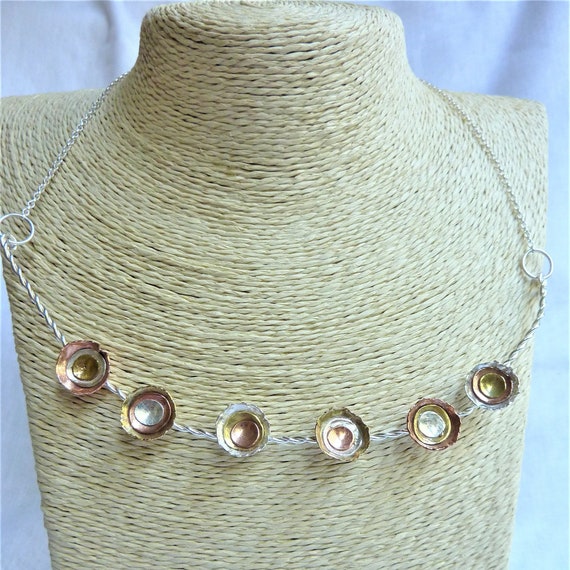 Twisted wire necklace with sterling silver, copper and brass dome cups