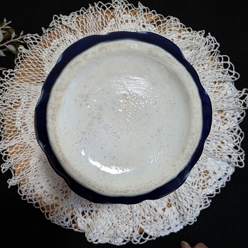 May include: A set of three ceramic mugs with a speckled, matte finish. Each mug features a different color: light blue, cream, and gray. The mugs have a simple, modern design with a rounded shape and a comfortable handle.