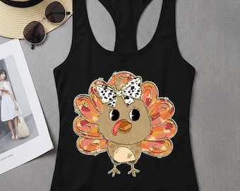 May include: Black racerback vest featuring a cartoon turkey with a bow. The turkey has a brown body, orange and yellow feathers, and a bow with black and white spots. The vest is sleeveless.