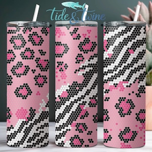 May include: Three cylindrical tumblers with white straws, featuring a pink, black, and white geometric dot pattern. The design combines leopard spots and zebra stripes created from small circular dots. The text "tide & twine" appears above.