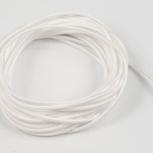 May include: A white cord or rope wound into a coil. The cord is about 1/4 inch thick.