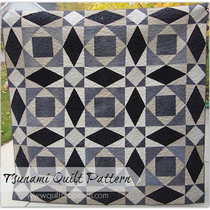 May include: A quilt pattern featuring a geometric design with black, gray, and beige squares and diamonds. The quilt is titled "Tsunami Quilt Pattern" and includes the website "www.quiltscapesas.com".