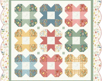 Könnte beinhalten: Ein Quiltblockmuster mit weißem Hintergrund und neun bunten Quadraten. Die Quadrate sind in einem 3x3-Raster angeordnet und zeigen Blumenmuster in Blautönen, Grün, Gelb, Rosa und Rot.