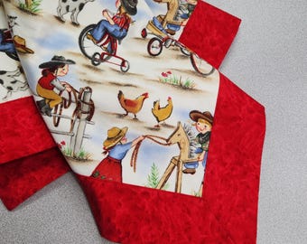 May include: A white fabric with a red border features a repeating pattern of children playing on a farm. The children are wearing cowboy hats and riding tricycles, horses, and rocking horses. There are also chickens and dogs in the pattern.