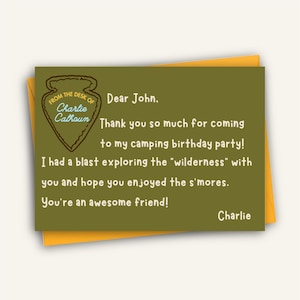 May include: A personalized greeting card with a green background and an orange envelope. The card reads "Dear John, Thank you so much for coming to my camping birthday party!" and is signed "Charlie". The card has a logo that says "From the desk of Charlie Calhoun."
