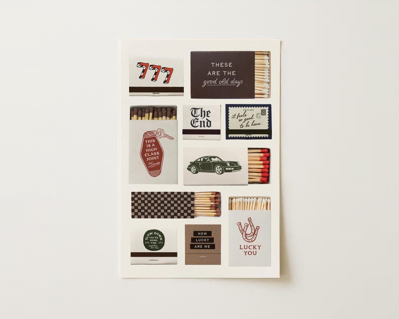 May include: A collection of decorative matchboxes with various designs and text. The matchboxes feature images of a car, a horseshoe, and the text "LUCKY YOU". Other boxes have the text "The End" and "These are the good old days".