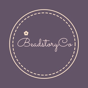 May include: A logo for Beadstory Co. features a cream-colored, dashed-line circle on a dark purple background. Inside the circle, the words "Beadstory Co" are written in a cursive font. A small flower graphic is above the word "Beadstory".