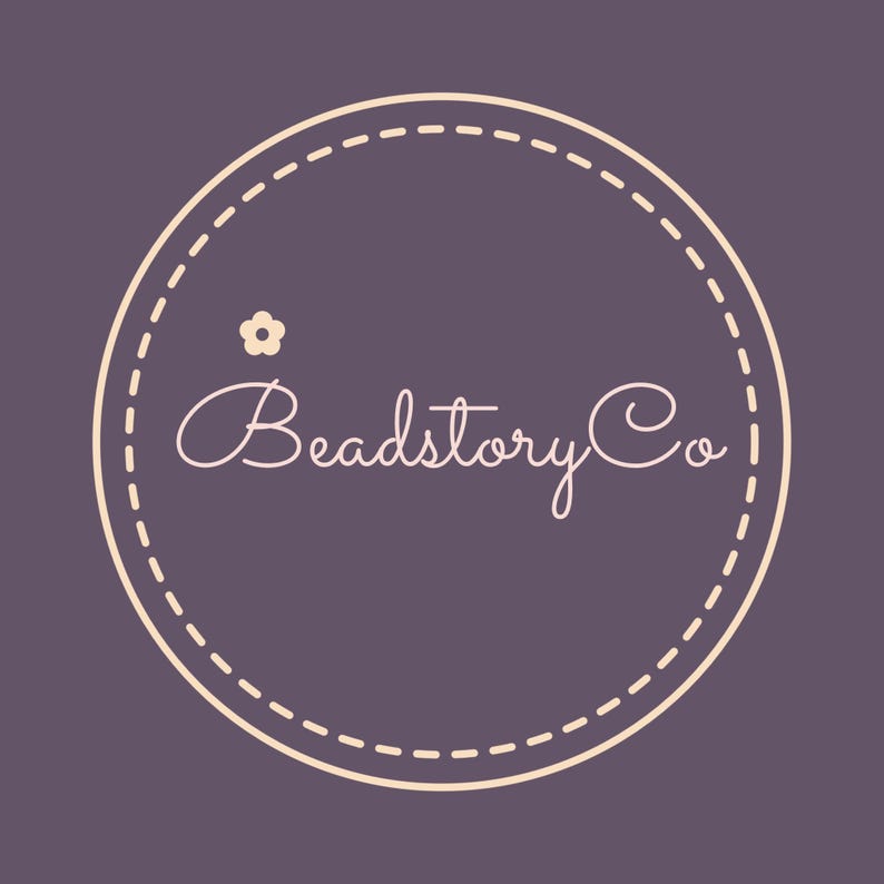 May include: A logo for Beadstory Co. features a cream-colored, dashed-line circle on a dark purple background. Inside the circle, the words "Beadstory Co" are written in a cursive font. A small flower graphic is above the word "Beadstory".