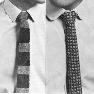 May include: Two knitted ties are displayed against a white shirt. One tie features a striped pattern in shades of gray and brown. The other tie has a textured, repeating pattern in dark gray and light gray.