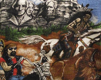 May include: A vintage t-shirt featuring a motorcycle, a Native American riding a horse, and a mountain range with the text "CHROME SPECIALTIES".