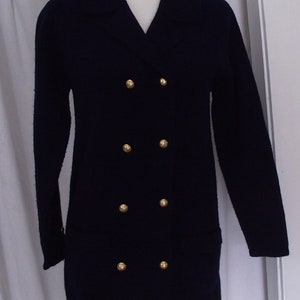 May include: A navy blue double-breasted jacket with gold buttons.