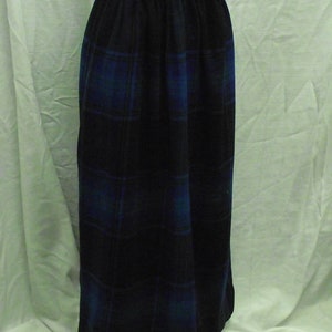 May include: A long black skirt with a blue and black plaid pattern.