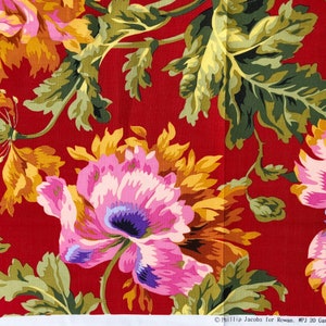 May include: Close-up of a fabric with a floral pattern. The design features large pink, purple, and yellow flowers with green leaves against a red background. The fabric is likely cotton or a similar material.