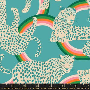 May include: A teal fabric featuring a repeating pattern of cream-colored leopards with teal spots, set against colorful rainbows. The text "RUBY STAR SOCIETY" is printed at the bottom.