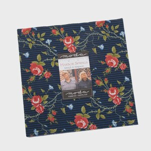 May include: A square stack of fabric squares featuring a dark blue background with thin black horizontal stripes and a floral pattern of red roses and small blue flowers. A paper label reads Harbor Springs by Minick & Simpson for Moda.