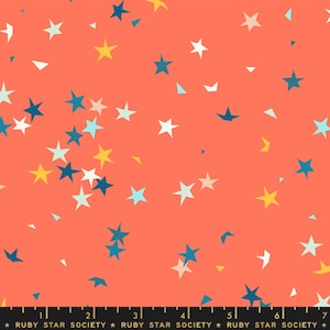 May include: Coral fabric featuring a random arrangement of stars in white, yellow, and blue hues. The stars are of different sizes and are spread across the material. The text "RUBY STAR SOCIETY" is at the bottom.