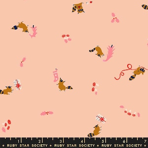 May include: A repeating pattern on a peach background features cartoon raccoons with blue and gold striped tails, holding gifts and ornaments. The design includes pink holly, mushrooms, and a Christmas stocking. The text "RUBY STAR SOCIETY" is at the bottom.