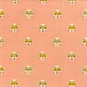 May include: A repeating pattern on a peach background features stylized sun faces with gold rays. The faces have cream-coloured skin, brown and blue eyes, and pink cheeks. The design is suitable for fabric or wallpaper.