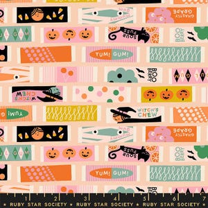 May include: A colorful Halloween-themed fabric pattern featuring various candy wrappers with illustrations of pumpkins, witches, and cats. The wrappers have text like "Yum! Gum!" and "Witch's Chew" on a light peach background.
