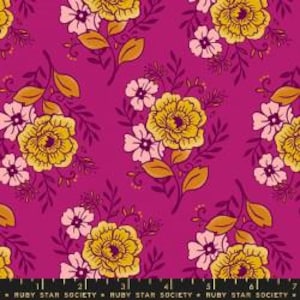 May include: A pink fabric with a repeating pattern of yellow and pink flowers with green leaves.