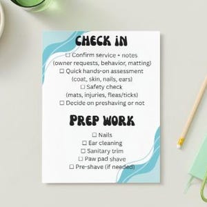 May include: A white notepad with blue wave accents and the words "CHECK IN" and "PREP WORK" in black. The notepad lists steps for a service. A pencil, keys, and a small green notebook are next to the notepad.