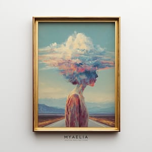 May include: Framed art print featuring a surreal image of a person with a cloud-like head, standing on a road. The artwork is set against a backdrop of a blue sky and a distant mountain range. The frame is gold. The text "MYAELIA DIGITAL WALL ART STORE" is at the bottom.