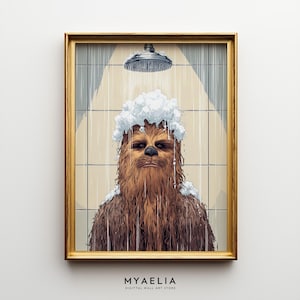 May include: A framed wall art print featuring a brown, furry, bipedal creature with a black nose standing under a shower head. The creature is covered in white soap suds while water streams down against a background of light-coloured square tiles.