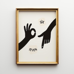May include: A framed art print with a gold frame. The artwork features black silhouettes of two hands, one forming an 'OK' gesture and the other pointing down. The words 'six' and 'seven' are written on beige circles.