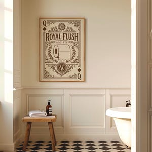May include: A rectangular wall art print in a wooden frame featuring a cream background with dark brown decorative borders and text. The design includes the words ROYAL FLUSH SOCIETY, a toilet paper roll illustration, and the letter Q in corners.