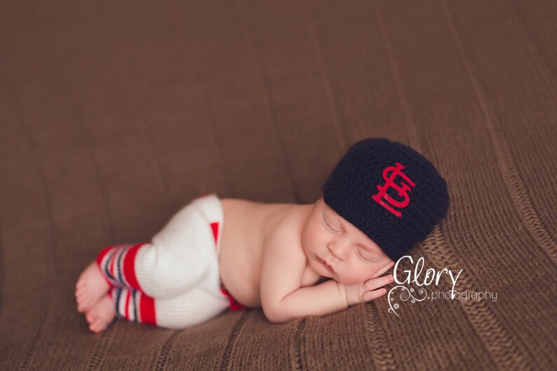 Baseball Cap For Newborn Boy On White Background. Generative AI Stock