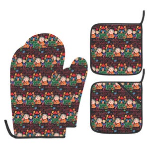 May include: A kitchen set consisting of one oven mitt and two square pot holders, all featuring a black background with a repeating colorful child-like drawing of a person and a house, including the text "MY GRANDMA IS THE BEST" and "LOVE CODY".