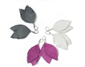 Suede leather feather earrings in fuchsia pink, light grey or pigeon grey.