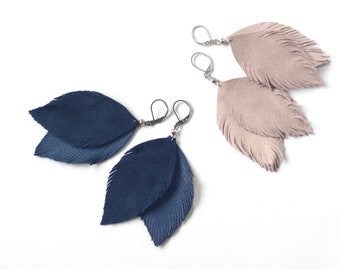 Beautiful feather earrings from suede leather in pale pink and blue.