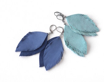 Beautiful feather earrings from suede leather in smoky blue and blue.