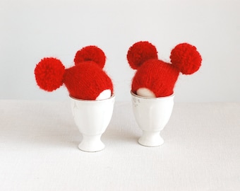 Red egg warmers with funny poms