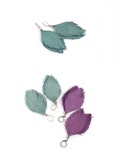 Suede leather feather earrings in violet and in smoky blue. Set of two pairs product logo