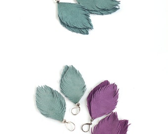 Suede leather feather earrings in violet and in smoky blue. Set of two pairs