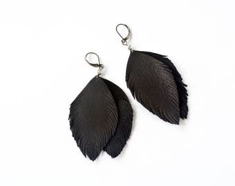 Black feather leather earrings