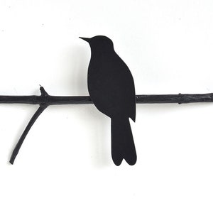 Blackbird on a perch, wall object made by renna deluxe