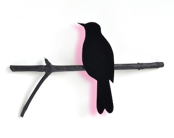 Blackbird on a perch, neon pink glow wall object made by renna deluxe