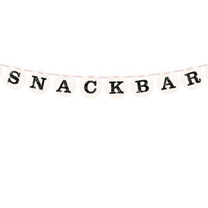 May include: A white banner with red hearts and black letters spelling "SNACKBAR" hanging on a red and white string.