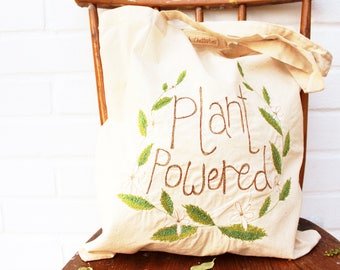 plant powered slogan tote bag recycled calico ( vegan )