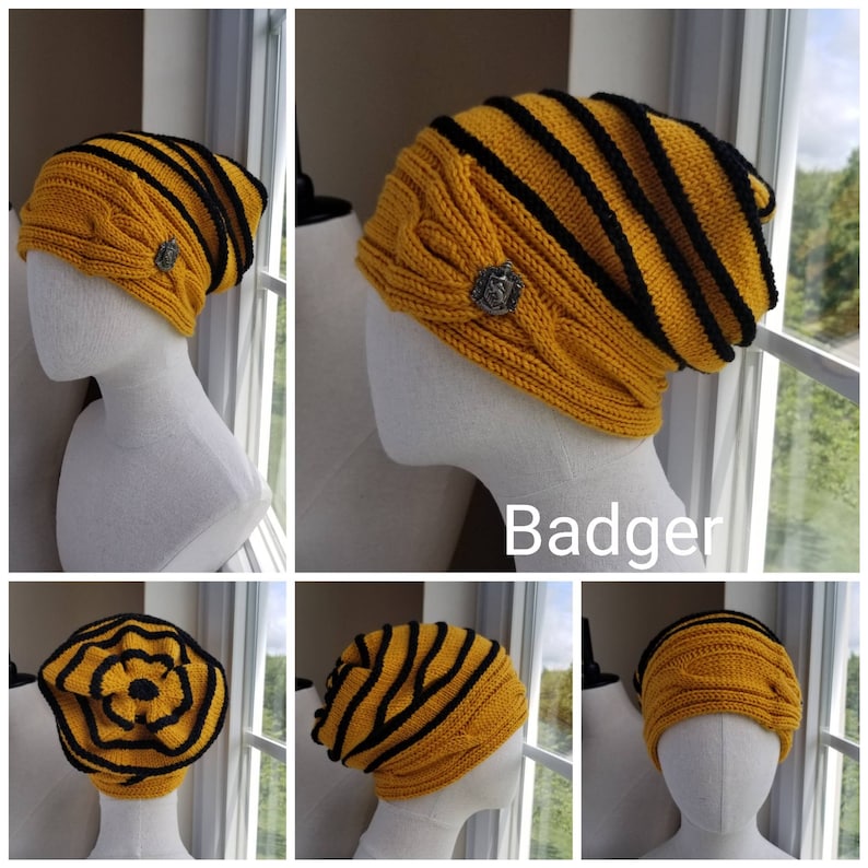 May include: A yellow and black striped knit beanie with a black flower design and a silver badge that says "Badger".