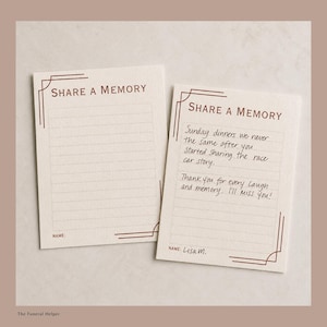 May include: Two rectangular off-white cards with dark red text and border accents. The cards feature the heading SHARE A MEMORY, horizontal lines for writing, and a space for a name. One card is blank, while the other contains handwritten text.