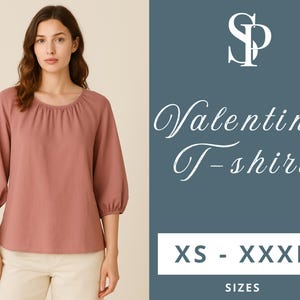 May include: A dusty rose coloured, long-sleeved, scoop neck t-shirt with a gathered neckline. The t-shirt has a relaxed fit and is available in sizes XS - XXXL. The text "Valentina T-shirt" is displayed in white on a blue background.